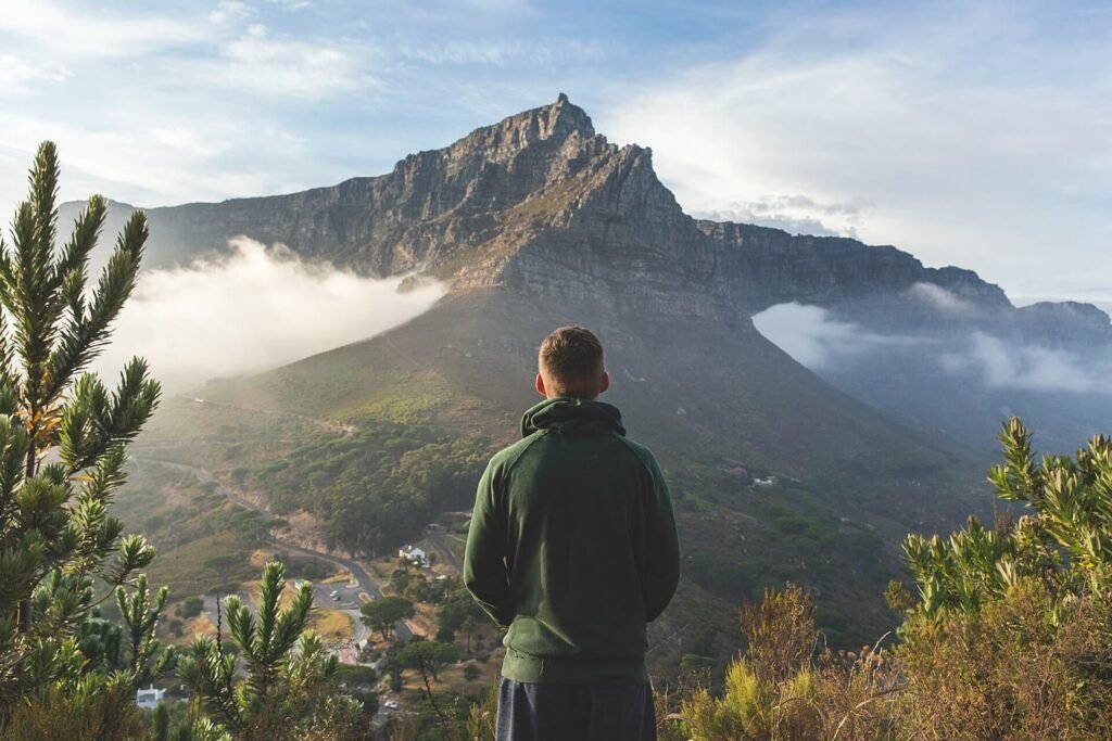 man facing mountain